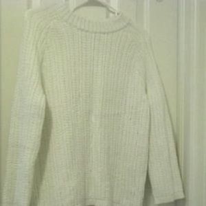 Woman’s sparkly white sweater